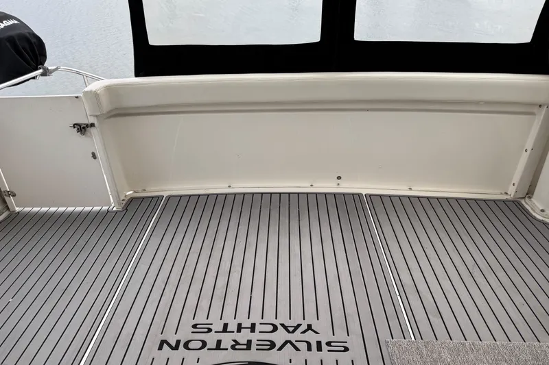 Slide: The Image of 2002 Silverton 352 Motor Yacht deck with Silverton Yachts branding. - 52