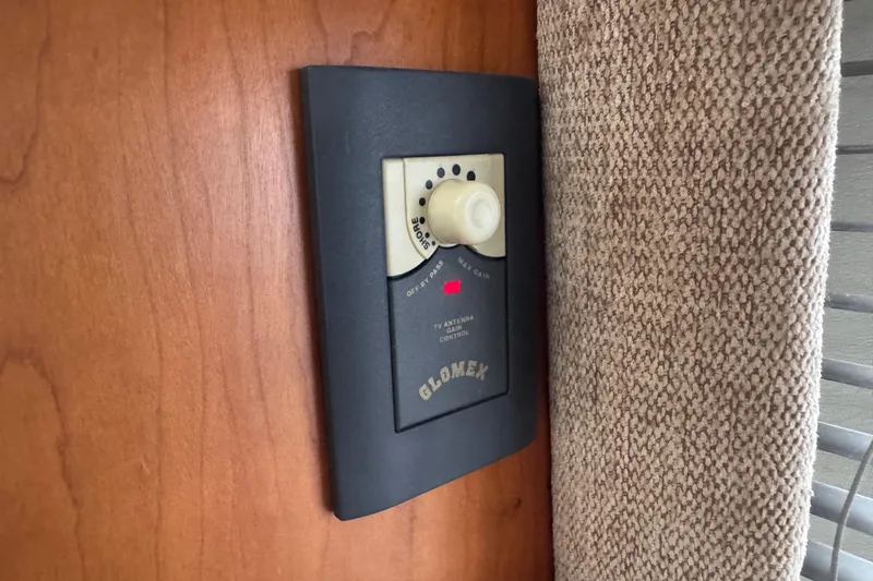 Slide: The Image of Glomex antenna control panel on 2002 Silverton 352 Motor Yacht interior wall. - 59