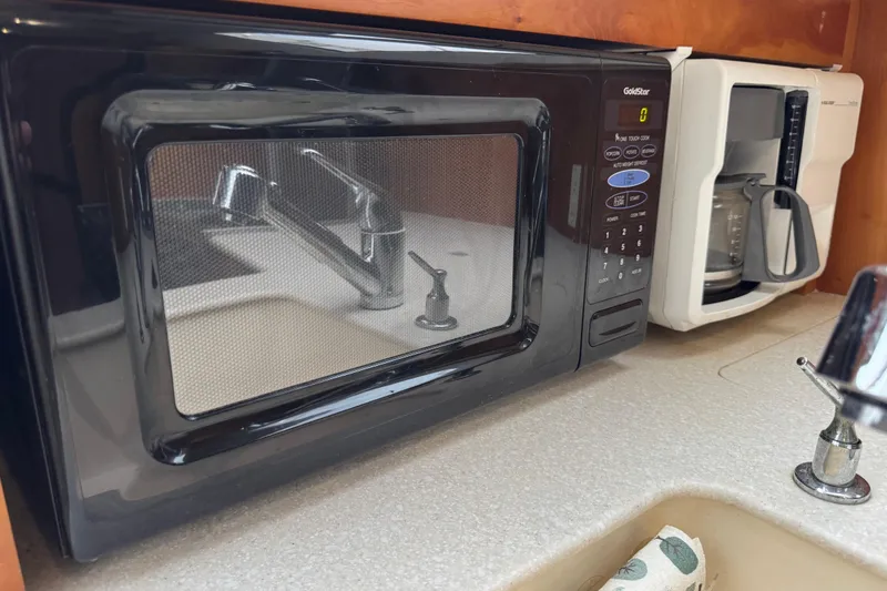 Slide: The Image of Microwave and coffee maker in 2002 Silverton 352 Motor Yacht kitchen. - 74