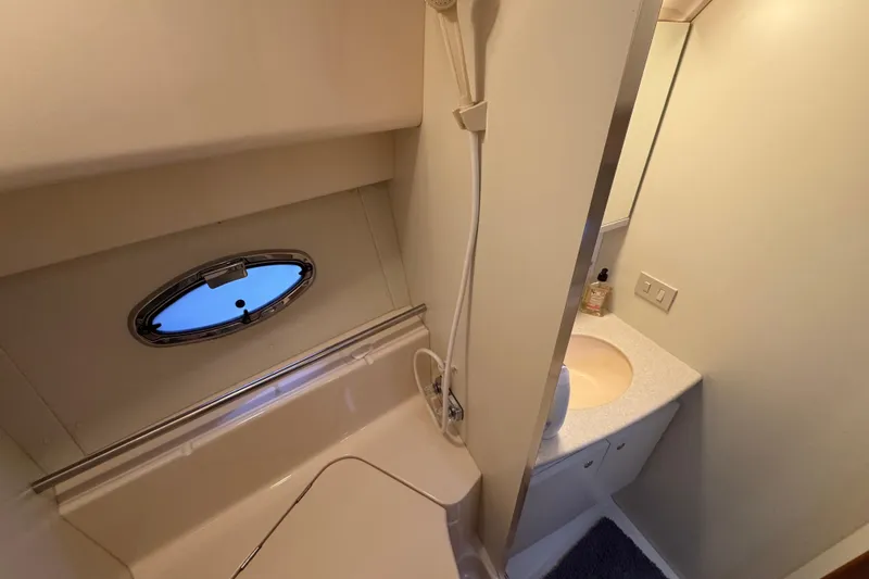 Slide: The Image of Bathroom interior of 2002 Silverton 352 Motor Yacht with shower and sink. - 79