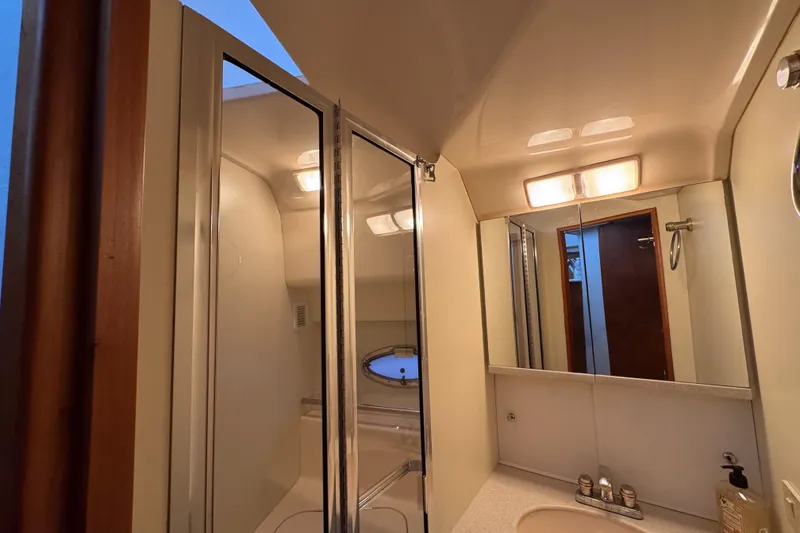 Slide: The Image of Bathroom interior of 2002 Silverton 352 Motor Yacht with mirror and lighting. - 82