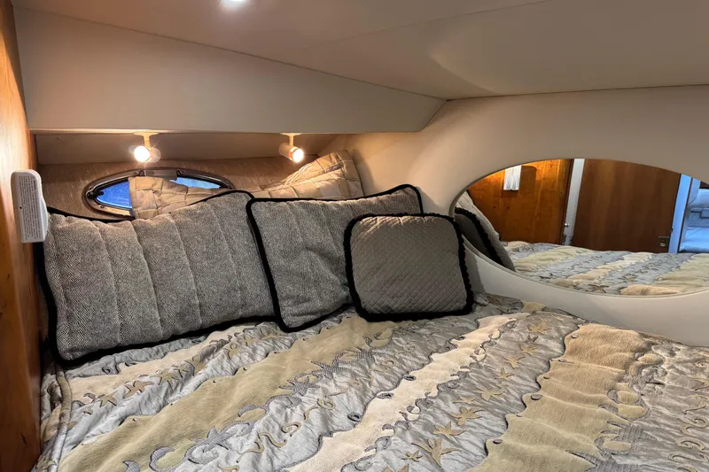 Slide: The Image of Cozy bedroom in 2002 Silverton 352 Motor Yacht with elegant bedding and soft lighting. - 83
