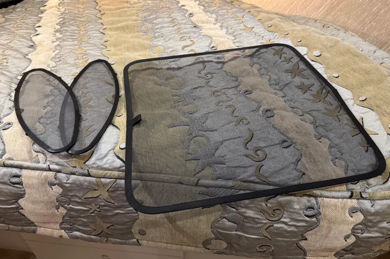 Slide: The Image of Mesh screens on patterned fabric inside a 2002 Silverton 352 Motor Yacht. - 86