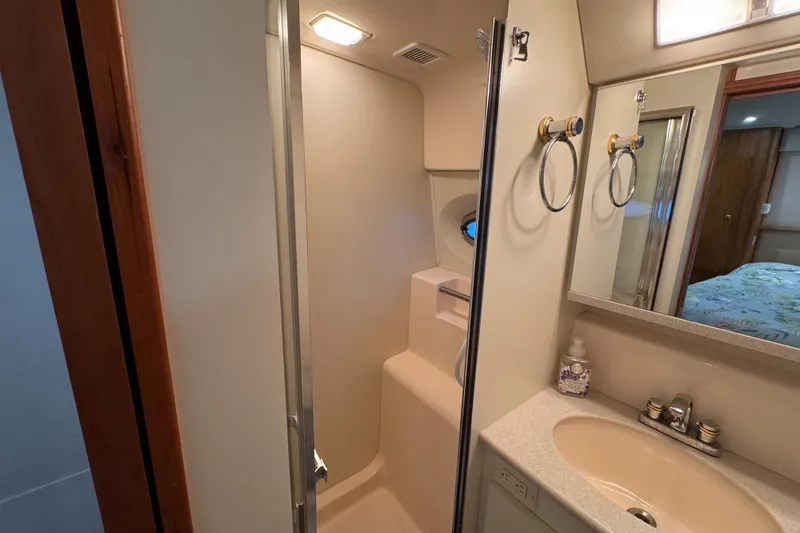 Slide: The Image of Bathroom interior of 2002 Silverton 352 Motor Yacht with shower and sink. - 96