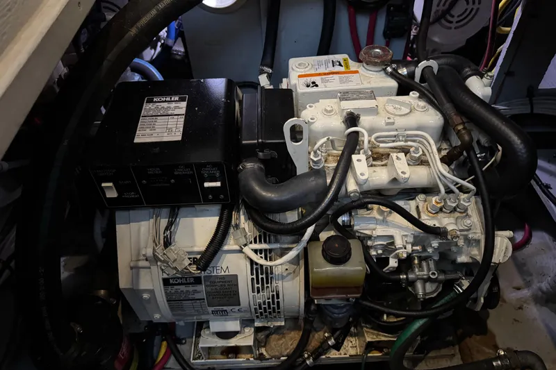 Slide: The Image of Engine room of a 2002 Silverton 352 Motor Yacht with Kohler generator. - 99