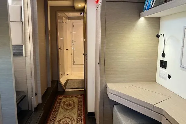 Slide: The Image of Interior of 2021 Fountaine Pajot Isla 40 catamaran, featuring a modern hallway and workspace. - 12