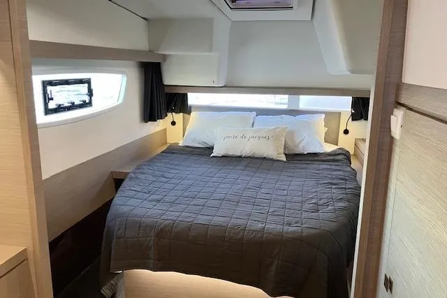 Slide: The Image of Luxurious bedroom interior of 2021 Fountaine Pajot Isla 40 catamaran with cozy bedding. - 14