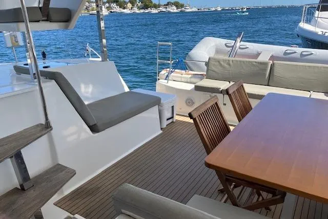 Slide: The Image of Outdoor seating area on 2021 Fountaine Pajot Isla 40 catamaran with ocean view. - 16