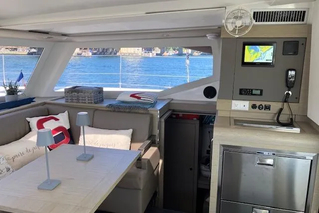 Slide: The Image of Interior of 2021 Fountaine Pajot Isla 40 catamaran with modern seating and ocean view. - 19