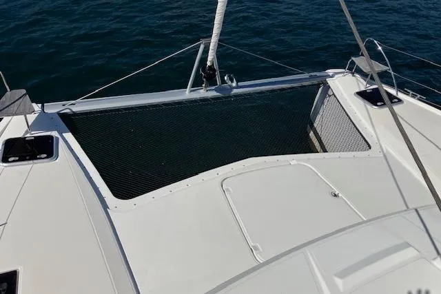 Slide: The Image of Fountaine Pajot Isla 40 catamaran deck, 2021 model, with netting over water. - 21