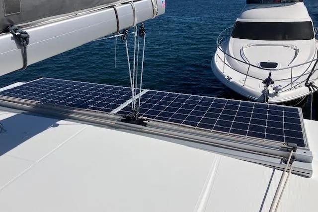 Slide: The Image of Solar panels on 2021 Fountaine Pajot Isla 40 catamaran, docked beside another boat. - 22