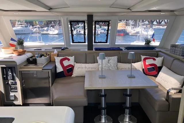 Slide: The Image of Interior of 2021 Fountaine Pajot Isla 40 catamaran with cozy seating and nautical decor. - 29