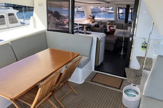 Slide: The Image of Fountaine Pajot Isla 40 catamaran, 2021 model, featuring a spacious outdoor dining area. - 31