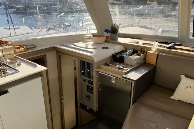 Slide: The Image of Interior of 2021 Fountaine Pajot Isla 40 catamaran with modern kitchen and seating area. - 34