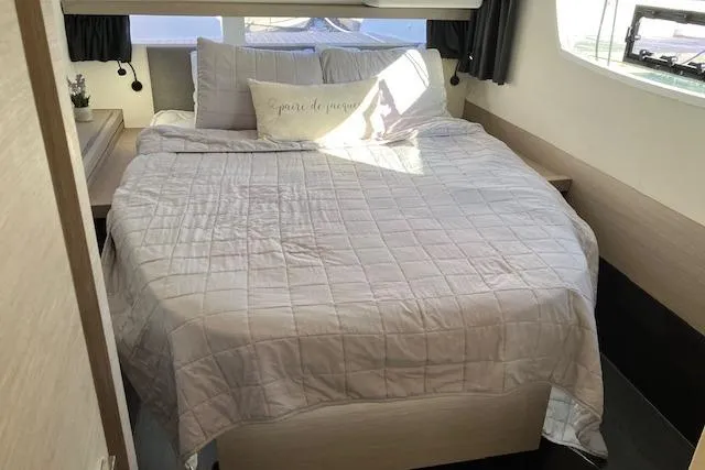 Slide: The Image of Cozy bedroom in 2021 Fountaine Pajot Isla 40 catamaran with elegant bedding. - 37