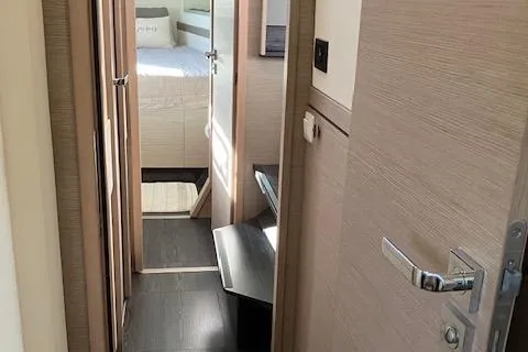 Slide: The Image of Interior hallway of 2021 Fountaine Pajot Isla 40 catamaran, featuring modern design and cozy cabin. - 38