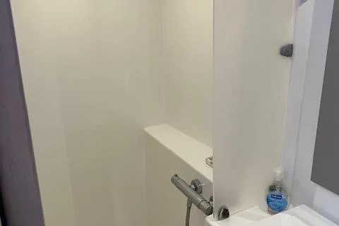 Slide: The Image of Shower area in 2021 Fountaine Pajot Isla 40 catamaran, featuring modern fixtures and soap dispenser. - 39