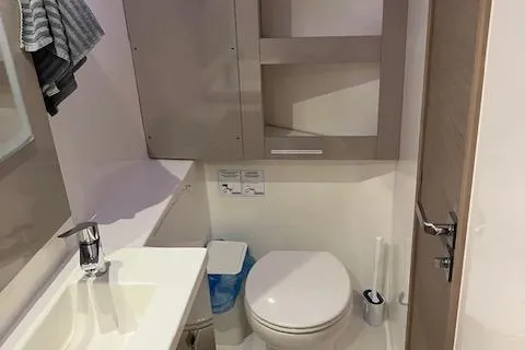 Slide: The Image of 2021 Fountaine Pajot Isla 40 bathroom with modern fixtures and compact design. - 40