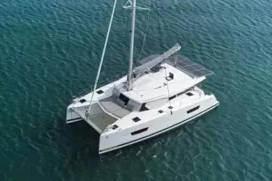 Slide: The Image of 2021 Fountaine Pajot Isla 40 catamaran sailing on clear blue water. - 43