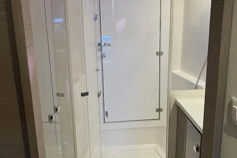 Slide: The Image of 2021 Fountaine Pajot Isla 40 yacht bathroom with modern shower and sleek design. - 8