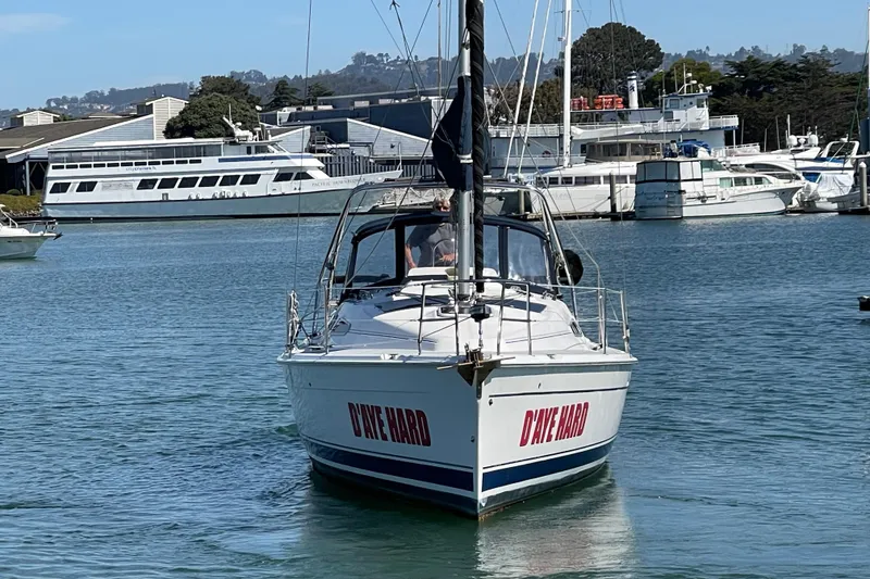 Slide: The Image of Hunter 33-2 sailboat from 2004 named "D'YER HARD" in a marina setting. - 2