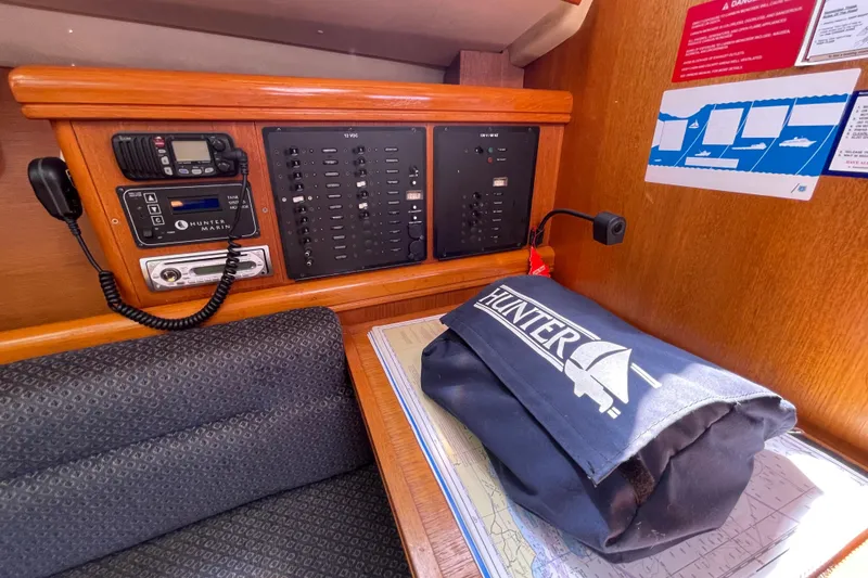 Slide: The Image of Control panel and equipment inside a 2004 Hunter 33-2 sailboat cabin. - 22