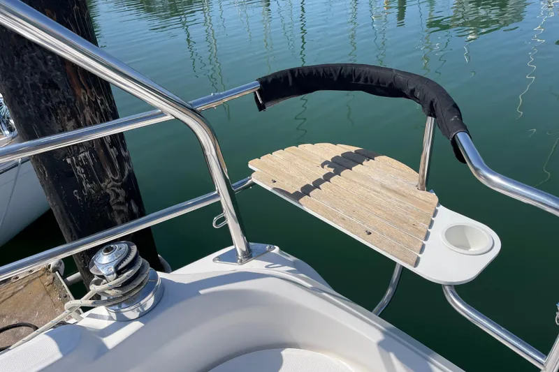 Slide: The Image of Stainless steel and wood swim platform on 2004 Hunter 33-2 sailboat. - 31