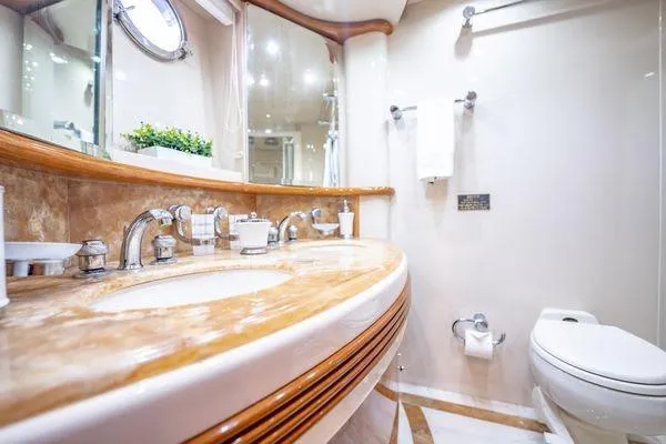 Slide: The Image of Luxurious bathroom in 2003 Azimut 80 Carat yacht with elegant fixtures and marble countertop. - 24