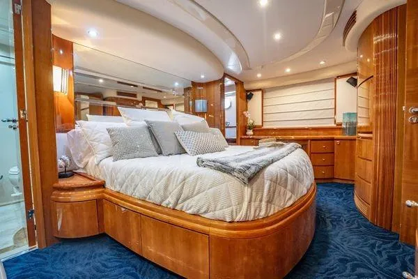 Slide: The Image of Luxurious bedroom interior of 2003 Azimut 80 Carat yacht with elegant wood finishes. - 29