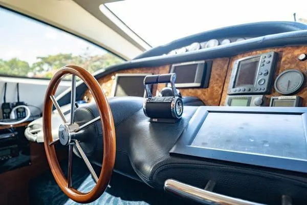 Slide: The Image of Cockpit of 2003 Azimut 80 Carat yacht with steering wheel and navigation instruments. - 36