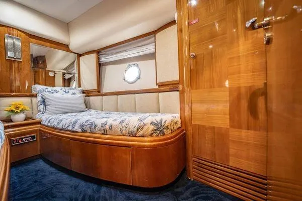 Slide: The Image of Luxurious cabin interior of 2003 Azimut 80 Carat yacht with elegant wood finish. - 5