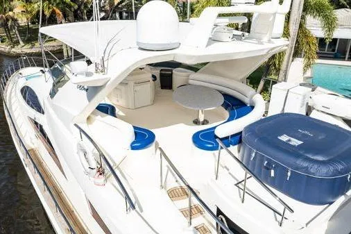 Slide: The Image of Luxurious 2003 Azimut 80 Carat yacht with spacious deck and elegant seating area. - 63