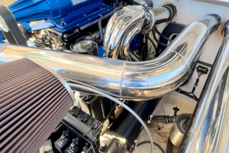 Slide: The Image of Engine compartment of a 2015 Donzi 38 ZR with polished metal components. - 17