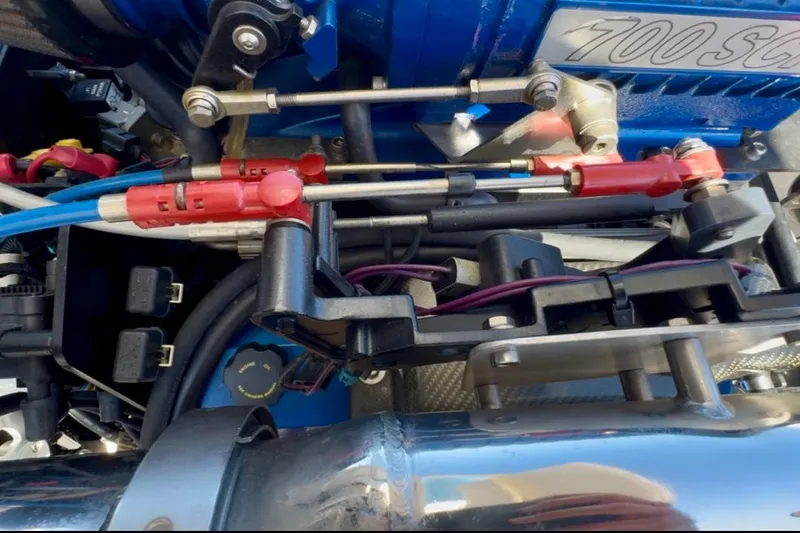 Slide: The Image of Engine components of a 2015 Donzi 38 ZR boat, featuring detailed mechanical parts. - 19