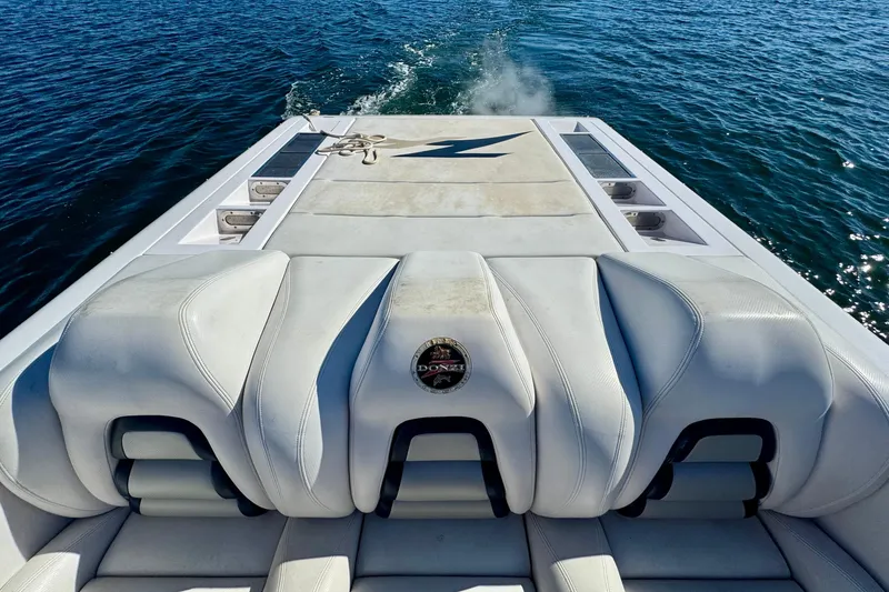 Slide: The Image of 2015 Donzi 38 ZR boat with white seating, cruising on open water. - 7