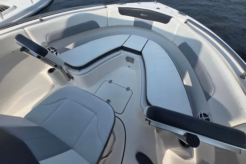 Slide: The Image of 2022 Robalo R222 Center Console boat interior with cushioned seating and storage compartments. - 10