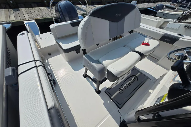Slide: The Image of 2022 Robalo R222 Center Console boat interior with seating and steering wheel. - 13