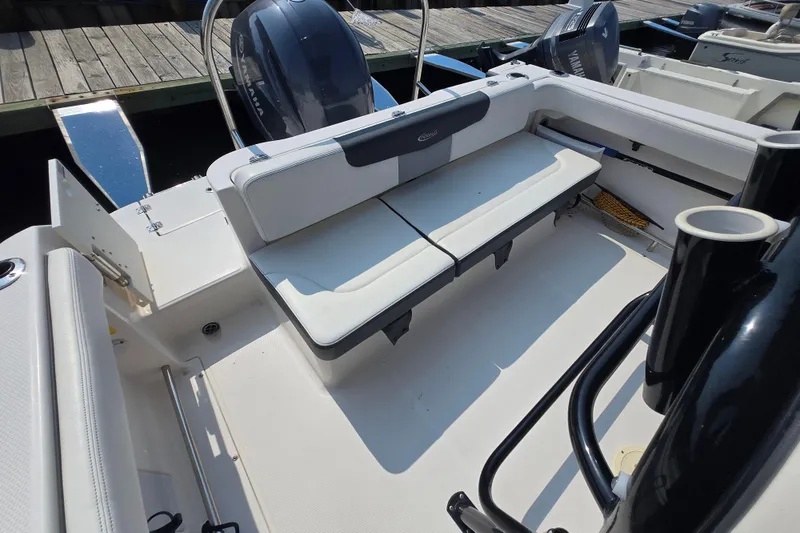 Slide: The Image of 2022 Robalo R222 Center Console boat interior with seating and Yamaha engine. - 14