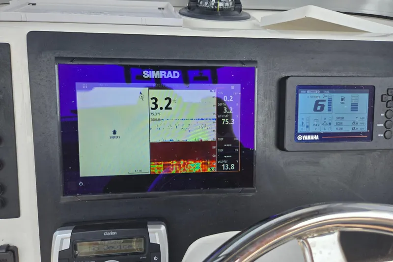 Slide: The Image of Simrad and Yamaha displays on 2022 Robalo R222 Center Console boat dashboard. - 26