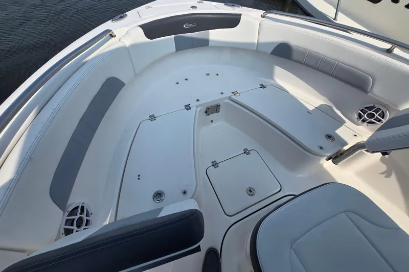 Slide: The Image of 2022 Robalo R222 Center Console boat interior with seating and storage compartments. - 7
