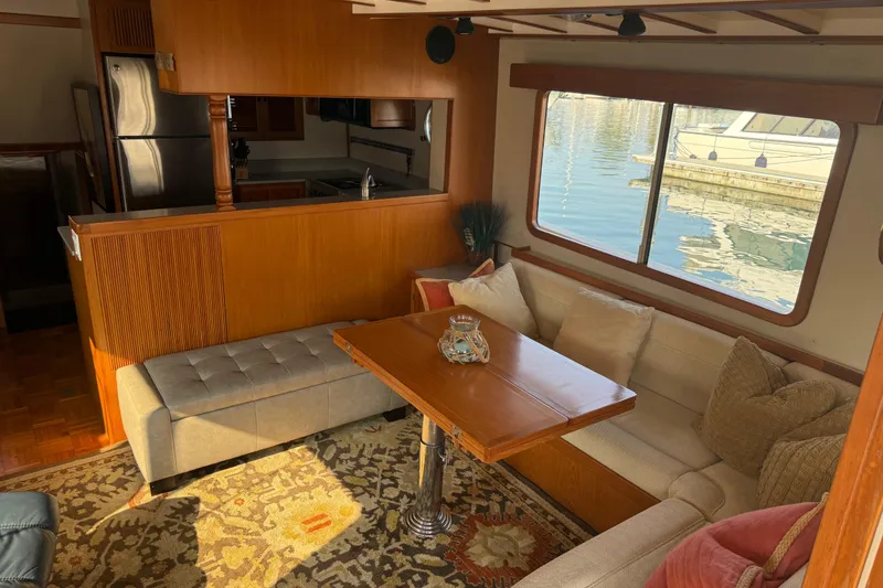 Slide: The Image of Interior of 1998 Kadey-Krogen 48' Northsea Widebody Pilothouse with cozy seating and kitchen. - 11