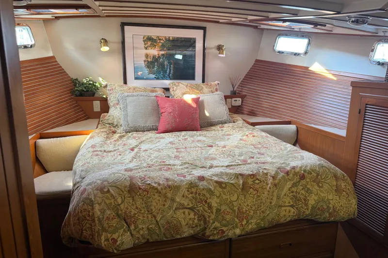 Slide: The Image of Cozy bedroom in 1998 Kadey-Krogen 48' Northsea Widebody Pilothouse with floral bedding and wood accents. - 18