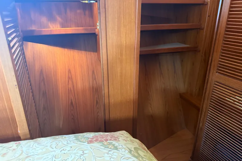 Slide: The Image of Wooden interior of 1998 Kadey-Krogen 48' Northsea Widebody Pilothouse with shelves and closet. - 22