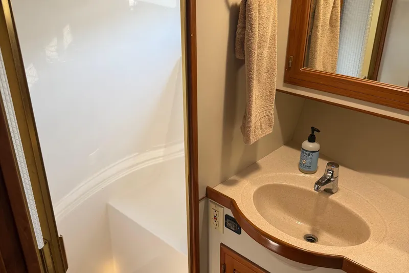 Slide: The Image of Bathroom interior of 1998 Kadey-Krogen 48' Northsea Widebody Pilothouse with sink and shower. - 24