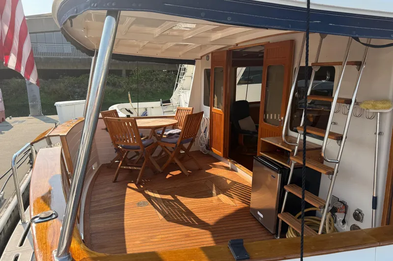 Slide: The Image of 1998 Kadey-Krogen 48' Northsea Widebody Pilothouse with wooden deck and outdoor seating area. - 4