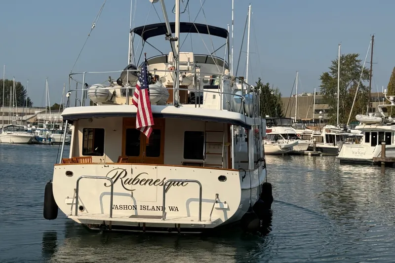 Slide: The Image of Kadey-Krogen 48' Northsea Widebody Pilothouse, 1998, docked with American flag, Vashon Island, WA. - 43