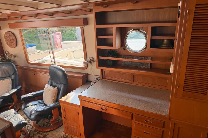 Slide: The Image of Interior of 1998 Kadey-Krogen 48' Northsea Widebody Pilothouse with wooden cabinetry and seating. - 10