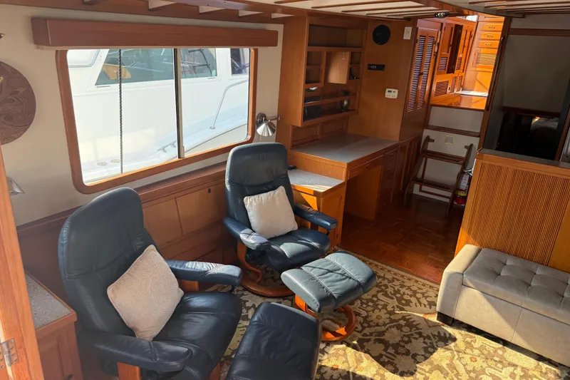Slide: The Image of Interior of 1998 Kadey-Krogen 48' Northsea Widebody Pilothouse with cozy seating and wooden accents. - 13