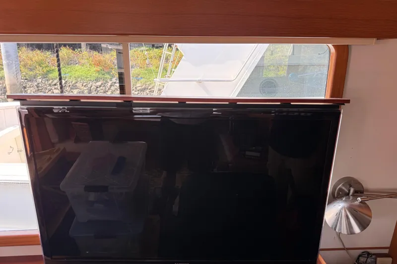 Slide: The Image of Interior view of 1998 Kadey-Krogen 48' Northsea Widebody Pilothouse with TV and window. - 14