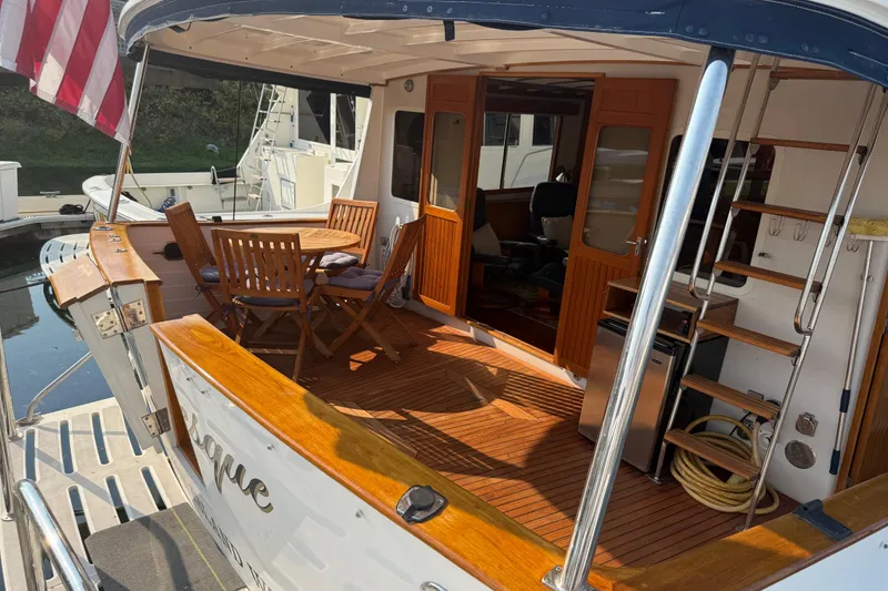 Slide: The Image of 1998 Kadey-Krogen 48' Northsea Widebody Pilothouse with wooden deck and outdoor seating. - 2